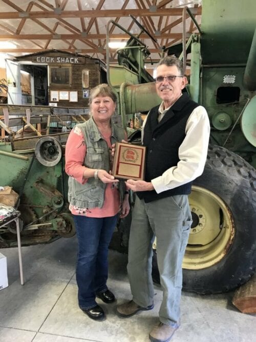 L to R: Judith Durfey, President of Branch 54, pictured making a HOF presentation to club member Arlin Colborg in 2021.